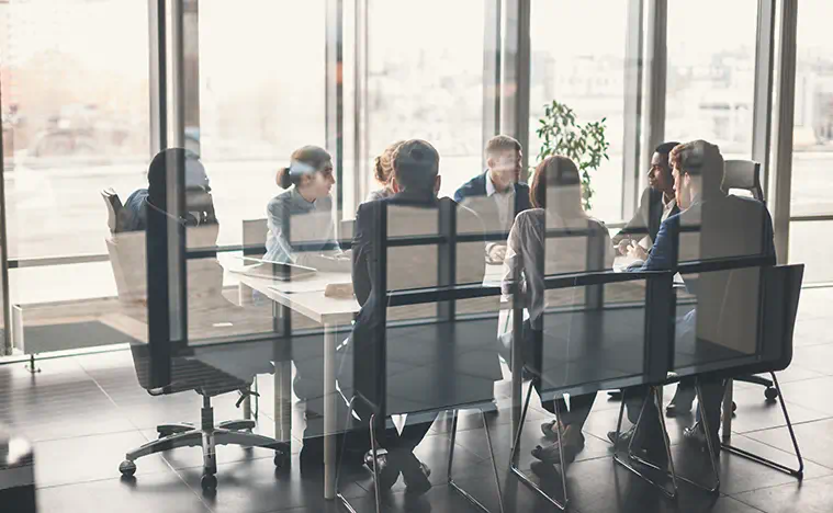 A group of business people holding a meeting.