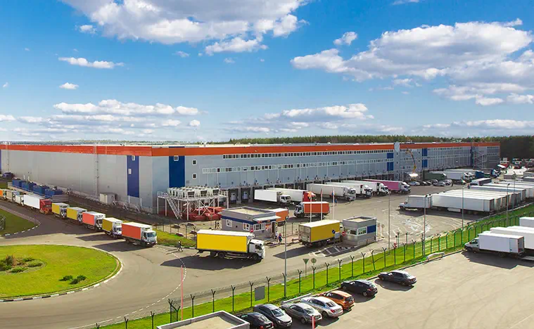Exterior birds eye view of a large industrial building.